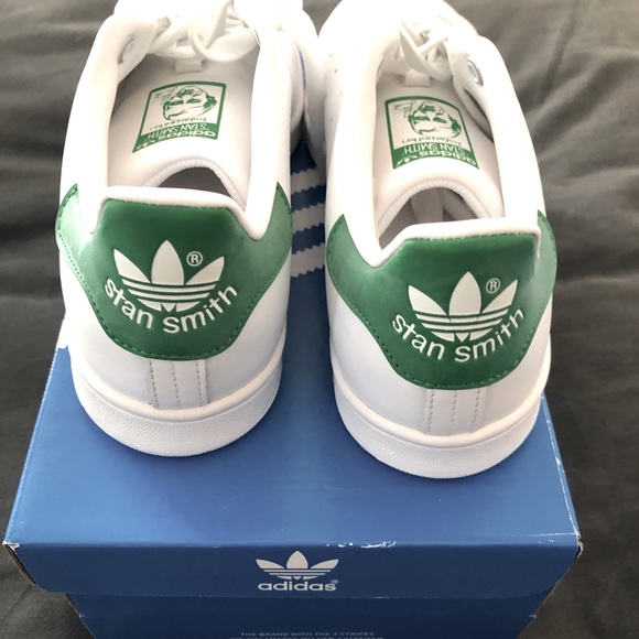all white adidas with green